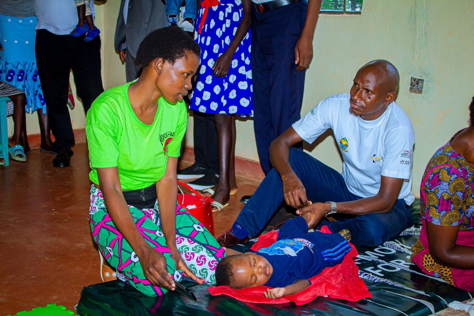 Clinicians examining a child during a therapy session